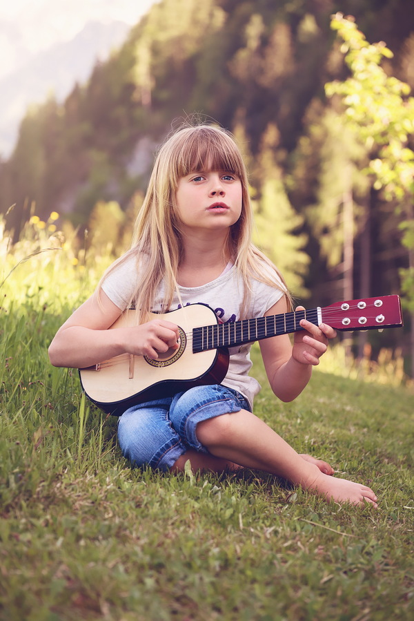 The little girl plays ukree Stock Photo