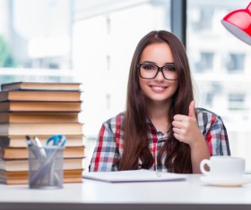 Thumbs up Young female student and book HD picture