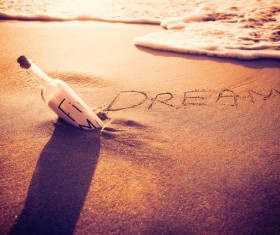 Twilight seaside drifting bottle Stock Photo