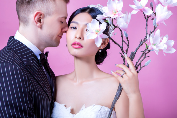 Wedding photographs of newlyweds and flowers Stock Photo