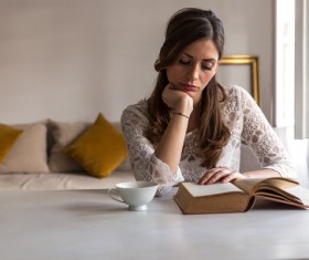 Woman reading with coffee Stock Photo