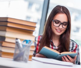 Young female student reading HD picture