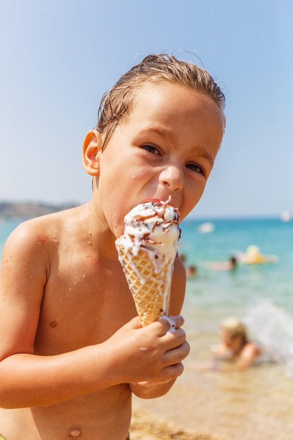 Beach children who eat ice cream Stock Photo 02