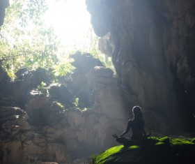Cave people meditating Stock Photo