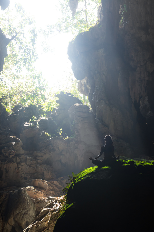 Cave people meditating Stock Photo