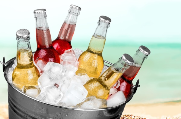 Ice cubes and beer in buckets Stock Photo