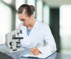Medical laboratory woman working with A microscope 01