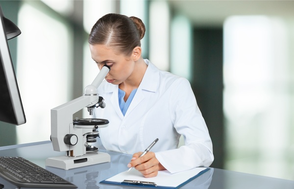 Medical laboratory woman working with A microscope 01