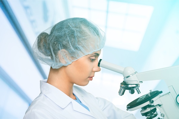 Medical laboratory woman working with A microscope 02