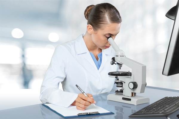 Medical laboratory woman working with A microscope 06