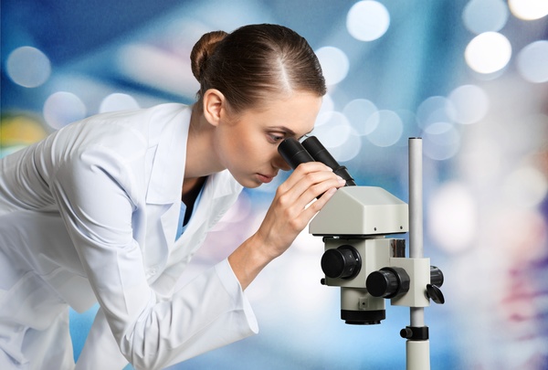 Medical laboratory woman working with A microscope 08