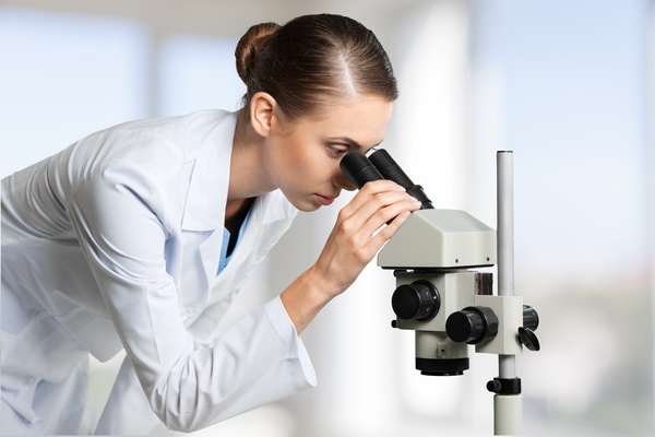 Medical laboratory woman working with A microscope 09