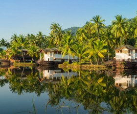 People on the river with palm trees Stock Photo