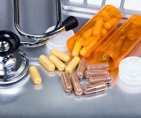 Pill with stethoscope Stock Photo