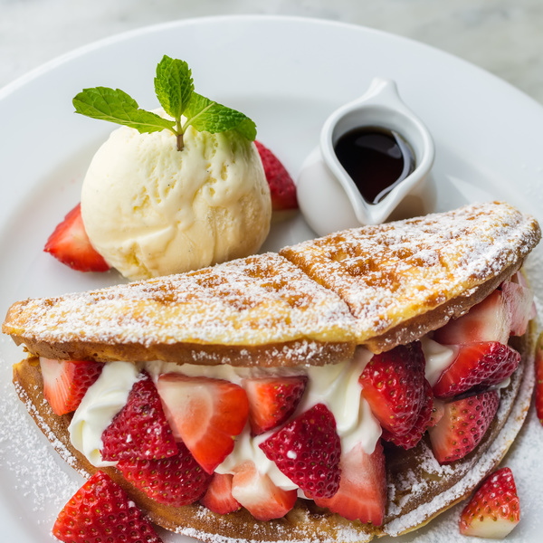 Sandwich with strawberry waffles and ice cream Stock Photo