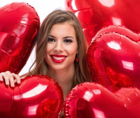 Smiling girl with a Valentines gift HD picture 17