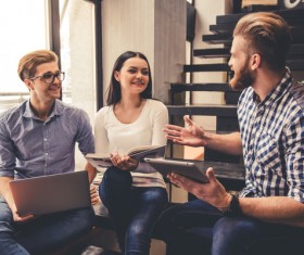 The young people who communicate with each other in the library
