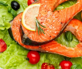 Tomato cabbage leaves and grilled salmon Stock Photo