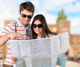 Tourists view the city map Stock Photo