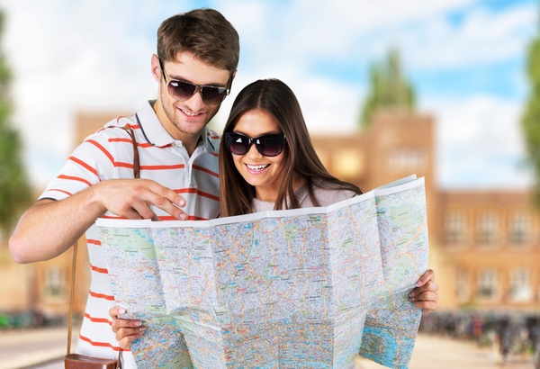Tourists view the city map Stock Photo