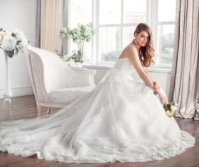 Bride in beautiful dress sitting resting on sofa Stock Photo 04