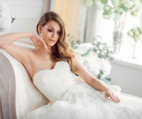 Bride in beautiful dress sitting resting on sofa Stock Photo 05