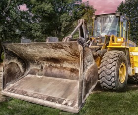Bulldozer parked beside the forest Stock Photo