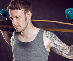 Carrying a youth skateboard Stock Photo