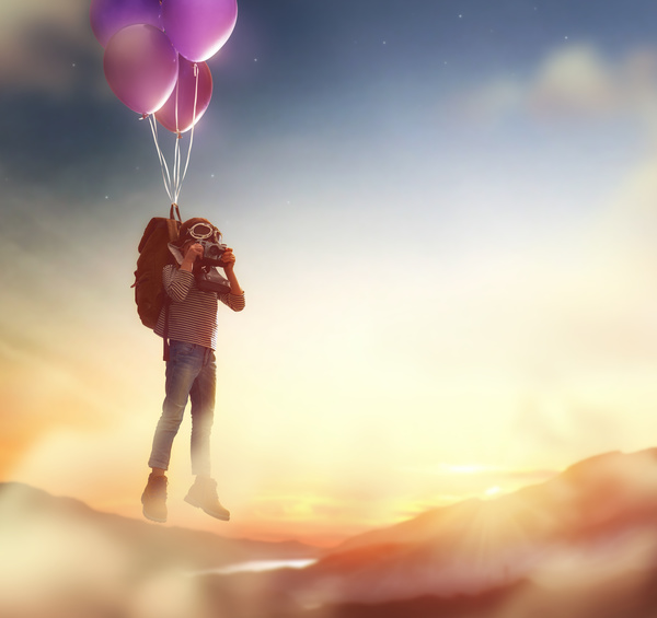 Children fly balloons and take pictures HD picture