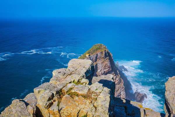 Coastal rocks and the vastness of the sea Stock Photo