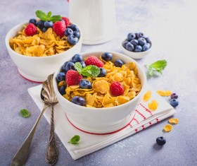 Corn flakes with berries and milk Stock Photo 01