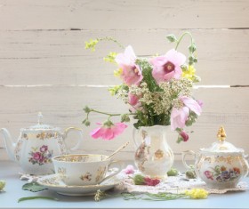 Exquisite tea and decorative flowers Stock Photo