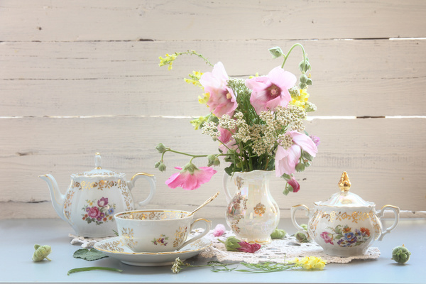 Exquisite tea and decorative flowers Stock Photo