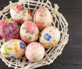 Flower baskets of different painted eggs Stock Photo
