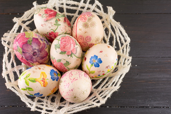 Flower baskets of different painted eggs Stock Photo