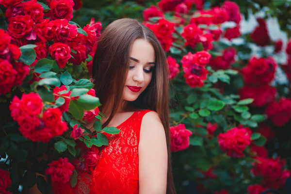 Girl in a red dress with red flowers Stock Photo
