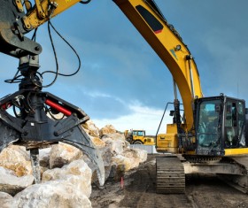 Grab the excavator of the stone Stock Photo