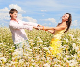 Happy young people in the flowers HD picture