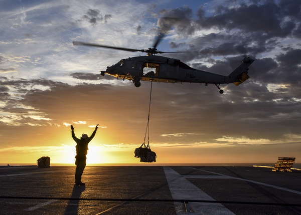 Helicopter unloading Stock Photo