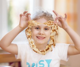 Little girl holding food Stock Photo