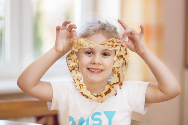 Little girl holding food Stock Photo