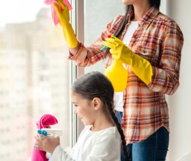 Mom and daughter cleaning house Stock Photo 02