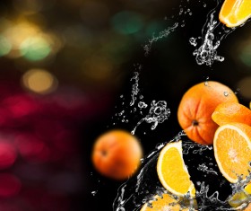 Oranges and splashing water Stock Photo 02