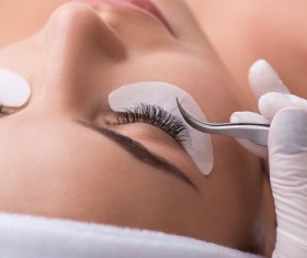 Pretty girl having her lashes lengthened Stock Photo 01