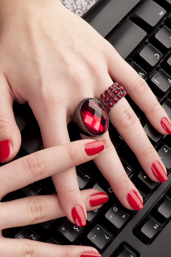 Red nail with keyboard Stock Photo