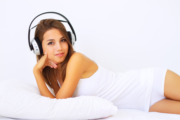 Smiling girl listening to music Stock Photo