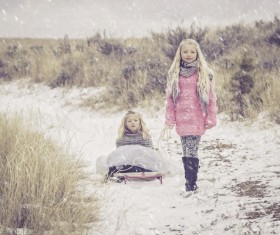 The sisters in the snow Stock Photo
