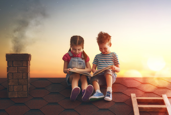 child reading on the roof Stock Photo