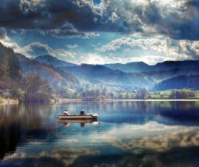 A man in a boat in the lake Stock Photo