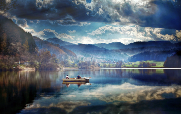 A man in a boat in the lake Stock Photo